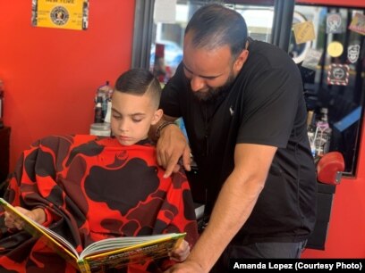 Barbershops put books in hands of kids getting haircuts