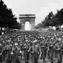 US soldiers of Pennsylvania's 28th Infantry Division march along the Champs-Elysees in Paris after the city's liberation