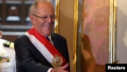FILE - Peru's President Pedro Pablo Kuczynski attends the swearing-in ceremony of new Interior Minister Vicente Romero at the government palace in Lima, Peru, Dec. 27, 2017.
