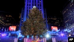 The Rockefeller Center Christmas Tree stands lit, Wednesday, Nov. 29, 2017, in New York. The 75-foot tall Norway spruce is covered with more than 50,000 multi-colored LED lights and will remain lit until Jan. 7. (Diane Bondareff/AP Images for Tishman Spey