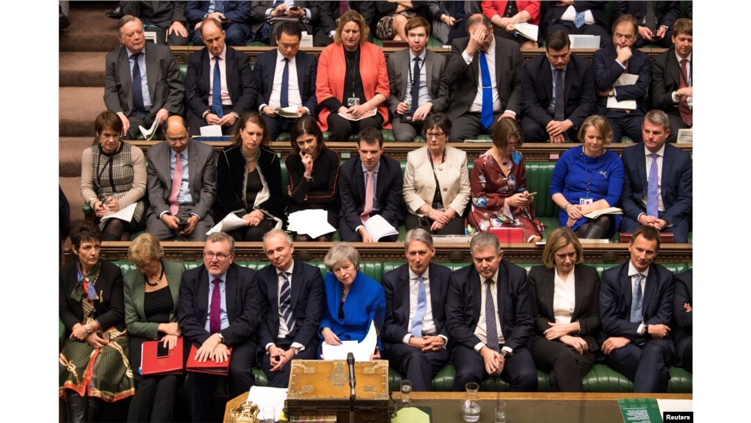 British Prime Minister Theresa May reacts during a no confidence debate after Parliament rejected her Brexit deal, in London, Britain, Jan. 16, 2019.