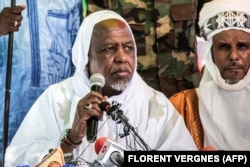 FILE —Malian influential imam Mahmoud Dicko at a public meeting in a rare appearance in Bamako on November 28, 2021.