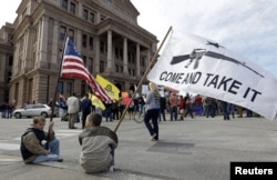 FILE - Gun rights supporters gather at a Guns Across America rally at the Texas state capitol in Austin, Texas, Jan. 19, 2013.