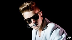 Canadian singer Justin Bieber performs on stage during the "I Believe Tour" in Helsinki, April 26, 2013.