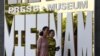 Women walk past the Vietnam Press Museum in Hanoi on July 16, 2020. - Vietnam's newly-opened Press Museum shows history of journalism in the communist country. (Photo by Nhac NGUYEN / AFP)