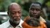 FILE - Varney Sherman (L) and his wife Joyce (front) arrive for a prayer service on the last night of election campaigning in Monrovia, 2005.