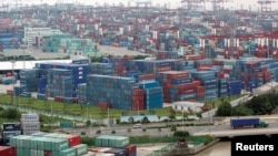 FILE - A container port in Shanghai, Aug. 11, 2009. China's trade surplus with the United States rose in June, but analysts are expecting a less favorable trade balance for China in the coming months.