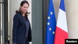 French Minister for Ecology, Sustainable Development and Energy Segolene Royal leaves following the weekly cabinet meeting at the Elysee Palace in Paris, Oct. 1, 2014. 