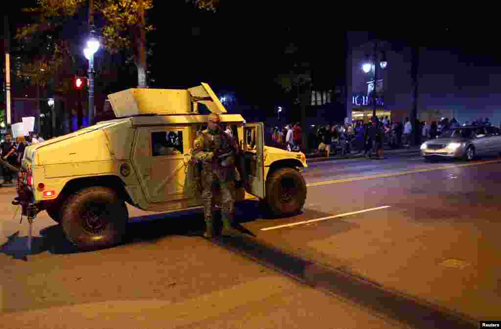 National Guard soldiers prepare for another night of protests over the police shooting of Keith Scott in Charlotte, North Carolina, Sept. 22, 2016.