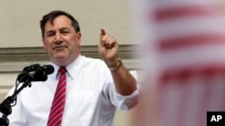 FILE - Sen. Joe Donnelly, D-Ind., speaks at a rally by United Steel Workers Local 1999 in Indianapolis, April 29, 2016. 