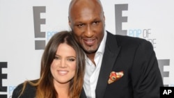 FILE - TV personality Khloe Kardashian Odom and professional basketball player Lamar Odom from the show "Keeping Up With The Kardashians" at an E! Network upfront event in New York, April 30, 2015.