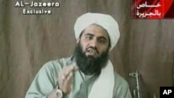 FILE - This image made from video provided by by Al-Jazeera shows Sulaiman Abu Ghaith, Osama bin Laden's son-in-law and spokesman, who is a Kuwaiti imam.