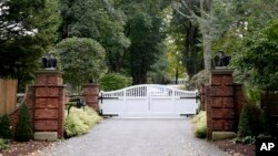 The gate is closed at the entrance to a house owned by philanthropist George Soros in Katonah, N.Y., a suburb of New York City, Oct. 23, 2018.