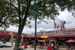 At the Eden Center parking lot, street names are in Vietnamese.