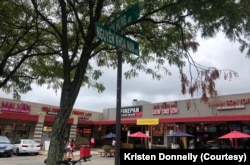 At the Eden Center parking lot, street names are in Vietnamese.