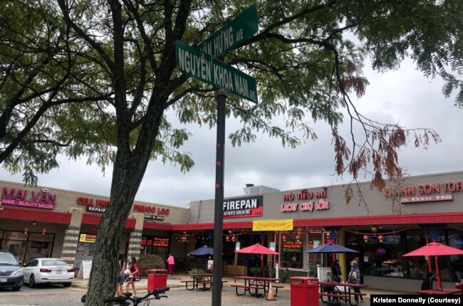 At the Eden Center parking lot, street names are in Vietnamese.