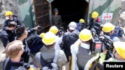 Journalists look around the third tunnel of Punggye-ri nuclear test ground before it is blown up during the dismantlement process in Punggye-ri, North Hamgyong Province, North Korea, May 24, 2018.