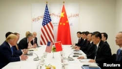 美国总统特朗普和中国国家主席习近平在G20领导人日本大阪峰会期间举行双边会晤。(2019年6月29日)