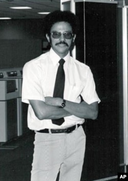 Warren Washington standing in front of one of the first Cray computers in 1970.