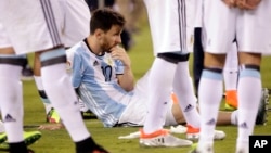Argentina's Lionel Messi waits for trophy presentations after the Copa America Centenario championship soccer match, Sunday, June 26, 2016, in East Rutherford, N.J. Messi was sentenced to 21 months in prison on Wednesday for his role in tax fraud in Spain. (AP Photo/Julie Jacobson)