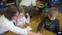 Four Winds Director Lisa Purcell leads a science workshop for 1st graders at Barstow Memorial School in Chittenden, Vermont.