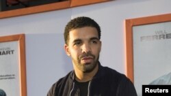 FILE - Rapper Drake poses at the premiere of "Get Hard" at the TCL Chinese theatre in Hollywood, California.