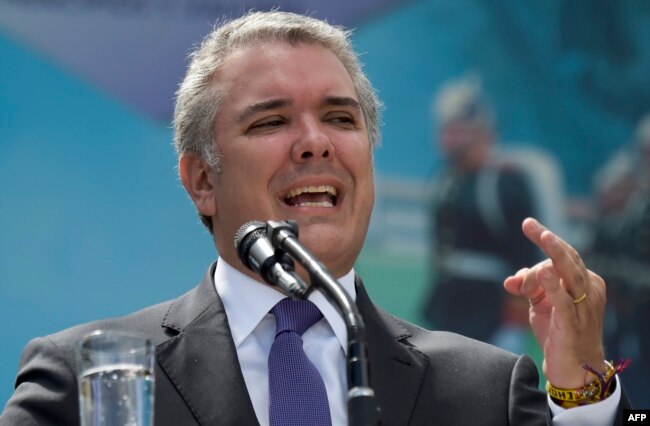FILE - Colombian President Ivan Duque speaks during a ceremony for the recognition of command of the Military Forces at the Jose Maria Cordova Military School in Bogota, Dec. 17, 2018.
