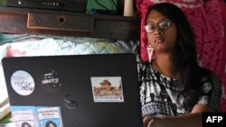 FILE - Rukshana Kapali, a transgender woman, works on her computer at her home in Patan near Kathmanduin, Nepal, this Aug. 29, 2018 photo.