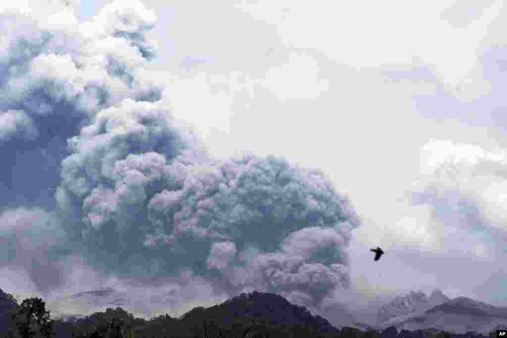 Mount Kelud erupts, as seen from Anyar village in Blitar, East Java, Indonesia, Feb. 14, 2014.