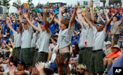 FILE - Boy Scouts sing and dance to music as they await the arrival of President Donald Trump at the 2017 National Boy Scout Jamboree at the Summit in Glen Jean, West Virginia, July 24, 2017.