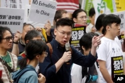 Taiwanese people gather to support Hong Kong people as the administration prepares to open debate on a highly controversial extradition law, in front of Hong Kong Economic, Trade and Culture Office in Taipei, Taiwan, June 12, 2019.