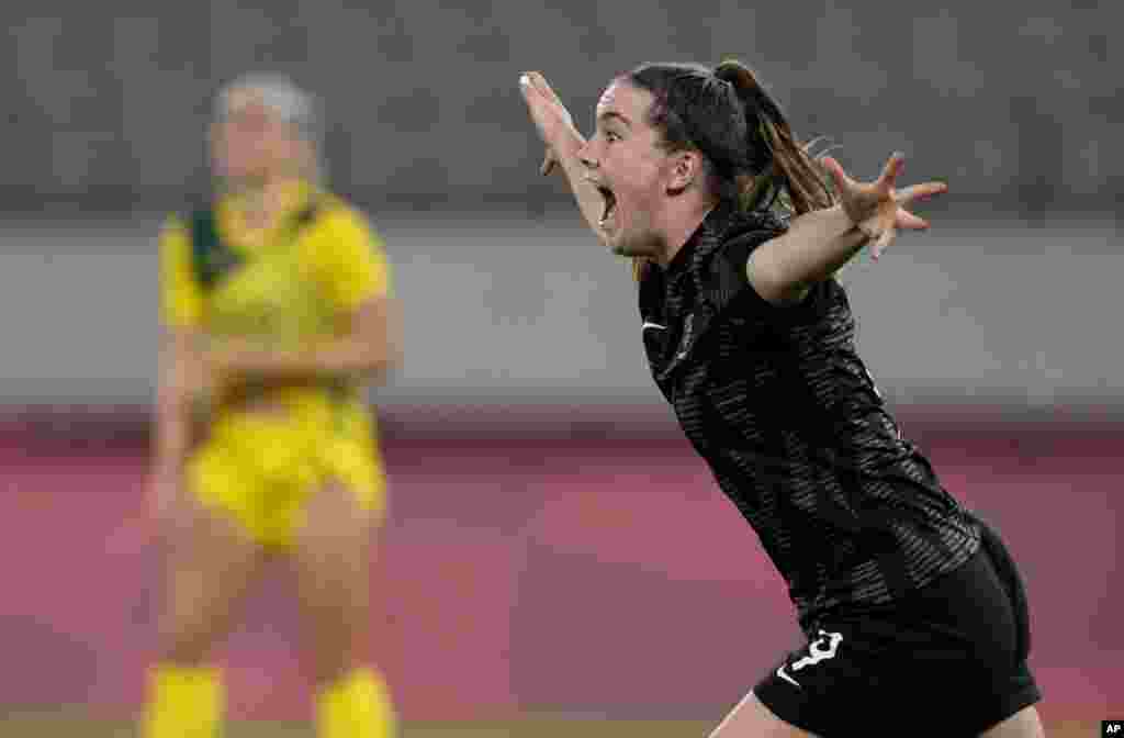 New Zealand's Gabi Rennie, right, celebrates after scoring her side's first goal during a women's soccer match against Australia at the 2020 Summer Olympics in Tokyo, Japan.