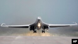 FILE - This July 24, 2008 file photo provided by the U.S. Air Force shows a 34th Bomb Squadron B-1B Lancer taking off from Ellsworth Air Force Base, S.D. 