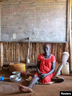 Nyayath Uluak, a displaced South Sudanese woman, sits in a shelter for civilians in Juba, South Sudan, June 17, 2017.