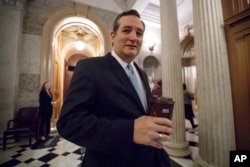 FILE - In this Feb. 3, 2017 file photo, Sen. Ted Cruz, R-Texas, departs the Senate chamber on Capitol Hill in Washington.