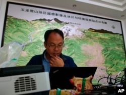 This Sept. 21, 2018 photo shows glaciologist Wang Shijin at the Chinese Academy of Science glacier station in Linjiang in the southern province of Yunnan in China. He and other researchers have tracked the Baishui Glacier No. 1.