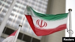 FILE: The Iranian flag flies in front of the U.N. nuclear watchdog (IAEA) headquarters in Vienna, Austria, May 24, 2021. 