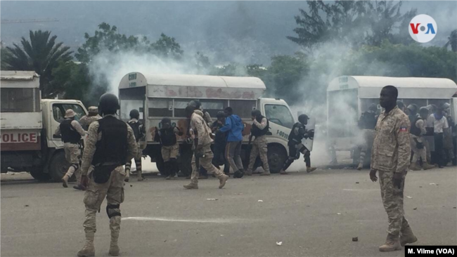 Police fire tear gas to disperse protesters in front of the parliament building in Port au Prince, Haiti, May 30, 2019.