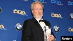 FILE - Ridley Scott, winner of the Lifetime Achievement in Feature Film Award, poses for photographers at the 69th annual DGA Awards in Beverly Hills, California, Feb. 4, 2017.