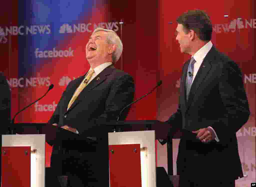 Newt Gingrich and Rick Perry at the Republican candidates debate in Concord, N.H., Jan. 8. (Reuters)