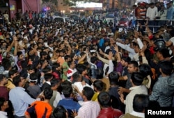 Demonstrators shout slogans outside a multiplex during a protest against the release of the upcoming Bollywood movie 'Padmaavat' in Ahmedabad, India, Jan. 23, 2018.