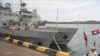 FILE - Cambodian navy crew members stand on a patrol boat at the Ream Naval Base in Sihanoukville, Cambodia, July 26, 2019. The U.S. Treasury Department on Nov. 10, 2021, imposed sanctions on two senior Cambodian defense officials over allegations of graft.