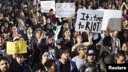 Demonstrators march following the election of Donald Trump as President of the United States through Oakland, California, U.S., Nov. 9, 2016.