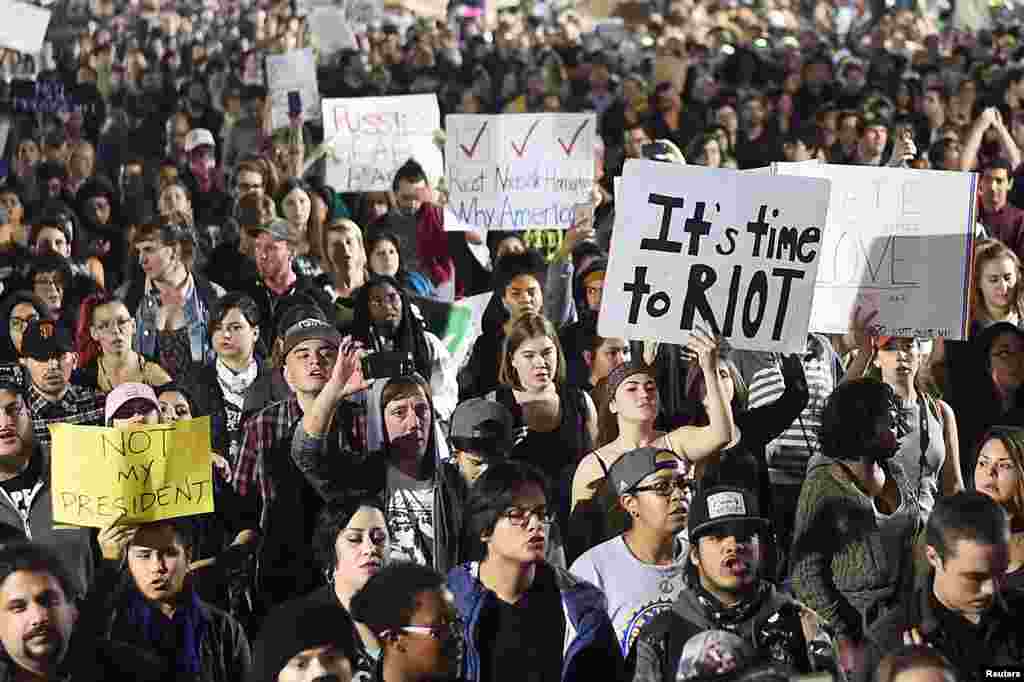 Demonstrators march following the election of Donald Trump as President of the United States through Oakland, California, U.S., Nov. 9, 2016.