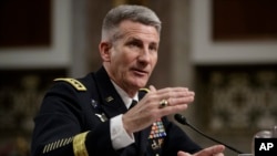 Gen. John Nicholson, the top U.S. commander in Afghanistan, testifies on Capitol Hill in Washington, Feb. 9, 2017, before the Senate Armed Services Senate Committee. Nicholson said he needs a "few thousand" more troops to better accomplish a key part of the mission in the war-torn country.