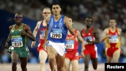 South Africa's Hezekiel Sepeng and Italy's Andrea Longo run in men's 800 meters at the Athens 2004 Olympic Games.