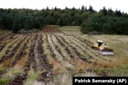 A bulldozer loosens the soil in a field in Monongahela National Forest, W.Va., on Aug. 27, 2019, in a process known as "deep ripping."