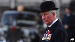 Prince Charles arrives for a remembrance service at the Guards' Chapel, Wellington Barracks, London, on the 100th anniversary of the signing of the Armistice which marked the end of World War I, Nov. 11, 2018.