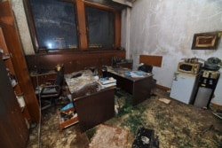 A damaged room is seen inside the mayor's office building after it was stormed by demonstrators during protests triggered by fuel price increase in Almaty, Kazakhstan, Jan. 5, 2022.