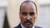 Mauritania's President Mohamed Ould Abdel Aziz listens to French President as they speak to journalists after a meeting at the Elysee Palace in Paris, November 20, 2012. 